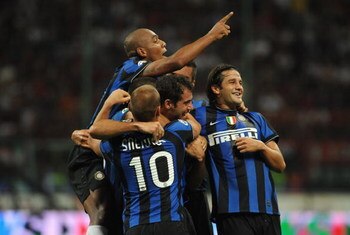 MILAN, ITALY - AUGUST 29:  The FC Inter Milan Team celebrate goal of Dejan Stankovic during the Serie A match between AC Milan and Inter Milan at Stadio Giuseppe Meazza on August 29, 2009 in Milan, Italy.  (Photo by Valerio Pennicino/Getty Images)