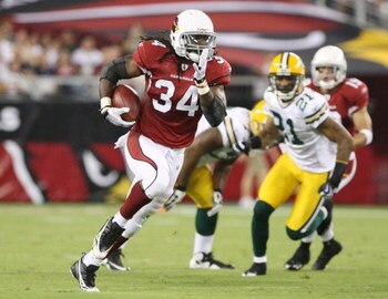 GLENDALE, AZ - AUGUST 28:  Running back Tim Hightower #34 of the Arizona Cardinals runs for a first down during the quarter against the Green Bay Packers at the University of Phoenix Stadium on August 28, 2009 in Glendale, Arizona.  (Photo by Christian Pe