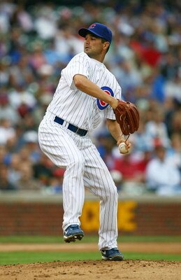 CHICAGO - AUGUST 28: Starting pitcher Ted Lilly #30 of the Chicago Cubs delivers the ball against the New York Mets on August 28, 2009 at Wrigley Field in Chicago, Illinois. The Cubs defeated the Mets 5-2.  (Photo by Jonathan Daniel/Getty Images)