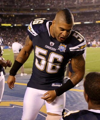 SAN DIEGO - SEPTEMBER 04:  Linebackers Shawne Merriman #56 of the San Diego Chargers jokes with teammates on the sidelines during the game with the San Francisco 49ers on September 4, 2009 at Qualcomm Stadium in San Diego, California. The Chargers won 26-