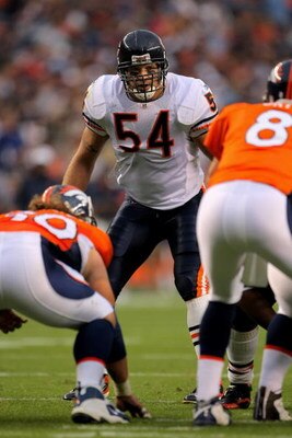 DENVER - AUGUST 30:  Line backer Brian Urlacher #54 of the Chicago Bears awaits the snap against quarterback Kyle Orton #8 of the Denver Broncos during preseason NFL action at INVESCO Field at Mile High on August 30, 2009 in Denver, Colorado. The Bears de