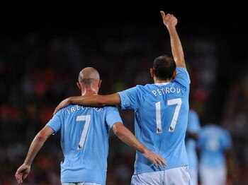 BARCELONA, SPAIN - AUGUST 19:  Martin Petrov (R) of Manchester City celebrates his goal with his teammate Stephen Ireland during the Joan Gamper Trophy match between Barcelona and Manchester City at the Camp Nou Stadium on August 19, 2009 in Barcelona, Sp