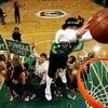 BOSTON - MAY 28:  The Boston Celtics mascot, 'Lucky' dunks the ball after receiving it from Tedy Bruschi of the New England Patriots during a break in play against the Detroit Pistons during Game Five of the Eastern Conference finals during the 2008 NBA P