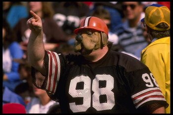 1988:  A Cleveland Brown fan in the Dog Pound watches his team play at Cleveland Stadium in Cleveland, Ohio. Mandatory Credit:  Rick Stewart/Allsport
