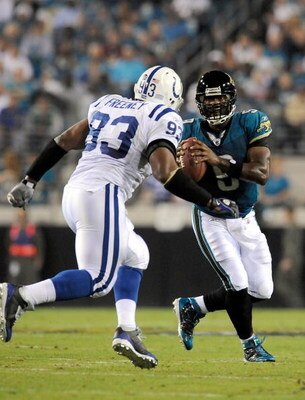 JACKSONVILLE, FL - DECEMBER 18:  David Garrard #9 of the Jacksonville Jaguars is pressured by Dwight Freeney #93 of the Indianapolis Colts during the game at Jacksonville Municipal Stadium on December 18, 2008 in Jacksonville, Florida.  (Photo by Sam Gree