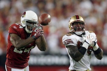 GLENDALE, AZ - NOVEMBER 10:  Adrian Wilson #24 of the Arizona Cardinals breaks up a pass to Vernon Davis #85 of the San Francisco 49ers during the fourth quarter at University of Phoenix Stadium on November, 10 2008 in Glendale, Arizona.  (Photo by Harry 