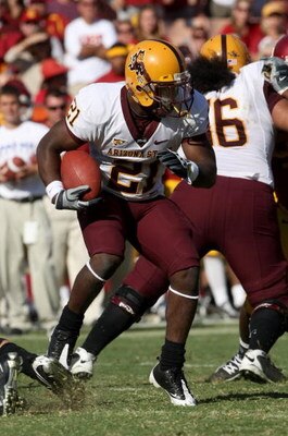 LOS ANGELES, CA - OCTOBER 11:  Running back Ryan Bass #21 of the Arizona State Sun Devils carries the ball against the USC Trojans on October 10, 2008 at the Los Angeles Coliseum in Los Angeles, California.  USC wond 28-0.  (Photo by Stephen Dunn/Getty Im