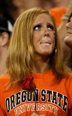 CORVALLIS, OR - NOVEMBER 29:  An Oregon State Beaver fan shows her dejection after a 65-38 loss to Oregon Ducks, dashing the Beavers' Rose Bowl hopes, at Reser Stadium on November 29, 2008 in Corvalis, Oregon.  (Photo by Jonathan Ferrey/Getty Images)