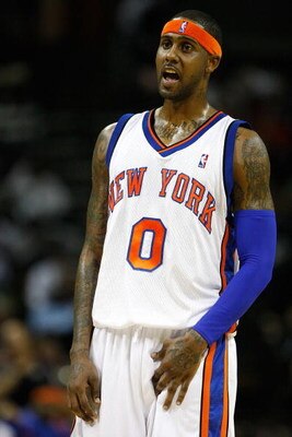 CHARLOTTE, NC - MARCH 28:  Larry Hughes #0 of the New York Knicks yells to a teammate during their game against the Charlotte Bobcats at Time Warner Cable Arena on March 28, 2009 in Charlotte, North Carolina.  NOTE TO USER: User expressly acknowledges and
