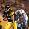 PITTSBURGH - SEPTEMBER 10:  Defensive end Jason Jones #91 tries to stop quarterback Ben Roethlisberger #7 of the Pittsburgh Steelers during the first quarter of the NFL season opener against the Tennessee Titans at Heinz Field on September 10, 2009 in Pit