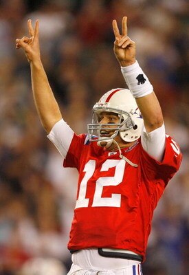 FOXBORO, MA - SEPTEMBER 14:  Tom Brady #12 of the New England Patriots signals that he will attempt a two-point conversion after touchdown in the fourth quarter against the Buffalo Bills in the fourth quarter at Gillette Stadium on September 14, 2009 in F