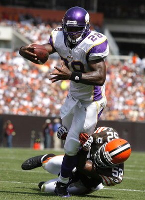 CLEVELAND - SEPTEMBER 13:  Adrian Peterson #28 of the Minnesota Vikings is hit by D'Qwell Jackson #52 of the Cleveland Brwons at Cleveland Browns Stadium on September 13, 2009 in Cleveland, Ohio.  (Photo by Matt Sullivan/Getty Images)