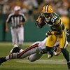 GREEN BAY, WI - SEPTEMBER 13: Greg Jennings #85 of the Green Bay Packers breaks away from Al Afalava #24 of the Chicago Bears on September 13, 2009 at Lambeau Field in Green Bay, Wisconsin. (Photo by Jonathan Daniel/Getty Images)