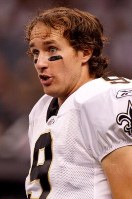 NEW ORLEANS - SEPTEMBER 03:  Quarterback Drew Brees #9 of the New Orleans Saints stands on the side lines during the game against the Miami Dolphins at the Louisiana Superdome on September 3, 2009 in New Orleans, Louisiana.  (Photo by Chris Graythen/Getty