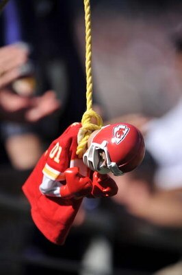 BALTIMORE - SEPTEMBER 13:  A fan of the Baltimore Ravens dangles a Kansas City Chiefs doll during the game at M&T Bank Stadium on September 13, 2009 in Baltimore, Maryland. The Ravens defeated the Chiefs 38-24. (Photo by Larry French/Getty Images)