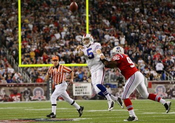FOXBORO, MA - SEPTEMBER 14:  Adalius Thomas #96 of the New England Patriots tries to stop quarterback Trent Edwards #5 of the Buffalo Bills  but he gets off his pass in the third quarter on September 14, 2009 at Gillette Stadium in Foxboro, Massachusetts.