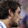 MADRID, SPAIN - SEPTEMBER 12:  Marco Belinelli of Italy reacts as he is being treated for a foot injury during the FIBA Eurobasket 2007 qualifying round group F match between Germany and Italy at the Telefonica Arena on September 12, 2007 in Madrid, Spain