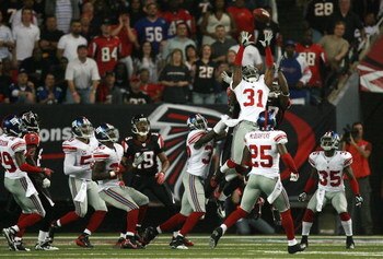ATLANTA - OCTOBER 15:  Cornerback Aaron Ross #31 of the New York Giants grabs in interception on a hail-mary pass attempt on the last play in the first half while taking on the Atlanta Falcons at Georgia Dome on October 15, 2007 in Atlanta, Georgia. The G