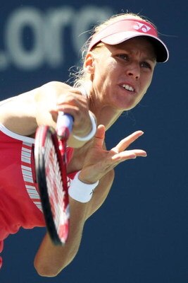 NEW YORK - SEPTEMBER 03:  Elena Dementieva of Russia serves against Melanie Oudin during day four of the 2009 U.S. Open at the USTA Billie Jean King National Tennis Center on September 3, 2009 in Flushing neighborhood of the Queens borough of New York Cit