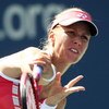 NEW YORK - SEPTEMBER 03:  Elena Dementieva of Russia serves against Melanie Oudin during day four of the 2009 U.S. Open at the USTA Billie Jean King National Tennis Center on September 3, 2009 in Flushing neighborhood of the Queens borough of New York Cit