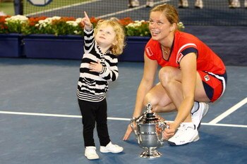 NEW YORK - SEPTEMBER 13:  Kim Clijsters of Belgium and daughter Jada pose with the championship trophy after Clijsters defeated Caroline Wozniacki of Denmark in the Women�s Singles final on day fourteen of the 2009 U.S. Open at the USTA Billie Jean King N