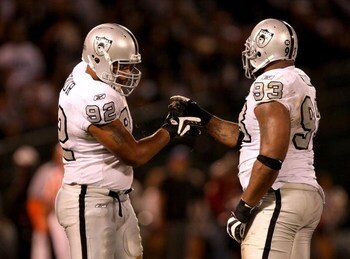 OAKLAND, CA - SEPTEMBER 14:  Richard Seymour #92 and Tommy Kelly #93 of the Oakland Raiders shake hands after a big play during their game against the San Diego Chargers on September 14, 2009 at the Oakland-Alameda County Coliseum in Oakland, California. 