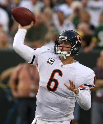 GREEN BAY, WI - SEPTEMBER 13: Jay Cutler #6 of the Chicago Bears makes a warm-up throw before a game against the Green Bay Packers on September 13, 2009 at Lambeau Field in Green Bay, Wisconsin. (Photo by Jonathan Daniel/Getty Images)