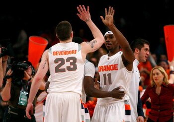 NEW YORK - MARCH 13: Eric Devendorf #23 and Paul Harris #11 of the Syracuse Orange react late in the game against the West Virginia Mountaineers during the semifinal round of the Big East Tournament at Madison Square Garden on March 13, 2009 in New York C