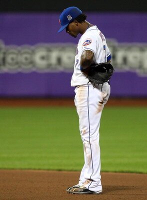 NEW YORK - MAY 11:  Jose Reyes #7 of the New York Mets reacts after commiting an error in the seventh inning against the Atlanta Braves on May 11, 2009 at Citi Field in the Flushing neighborhood of the Queens borough of New York City.  (Photo by Jim McIsa