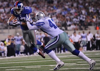 ARLINGTON, TX - SEPTEMBER 20:  Wide receiver Steve Smith #12 of the New York Giants dives for a touchdown against Gerald Sensabaugh #43 of the Dallas Cowboys at Cowboys Stadium on September 20, 2009 in Arlington, Texas.  (Photo by Ronald Martinez/Getty Im