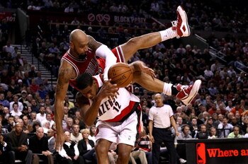 PORTLAND, OR - NOVEMBER 19:  Drew Gooden #90 of the Chicago Bulls falls over the top of LaMarcus Aldridge #12 of the Portland Trail Blazers  at the Rose Garden November 18, 2008 in Portland, Oregon.  NOTE TO USER: User expressly acknowledges and agrees th
