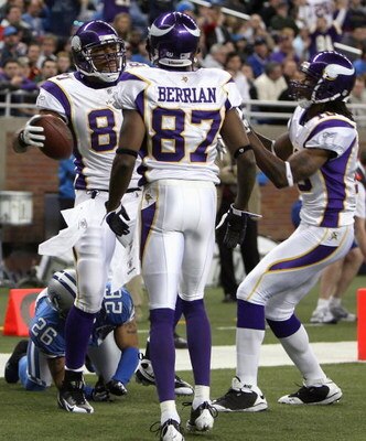 DETROIT - DECEMBER 07:  Tight end Visanthe Shiancoe #81 of the Minnesota Vikings celebrates with Bernard Berrian #87 and Sidney Rice #18 after scoring a 11 yard touchdown reception against the Detroit Lions during the fourth quarter of the NFL game at For