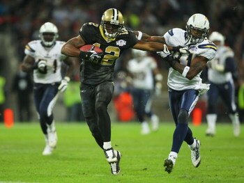 LONDON - OCTOBER 26:  Marques Colston of the New Orleans Saints holds off Antonio Cromartie of the San Diego Chargers during the Bridgestone International Series NFL match between San Diego Chargers and New Orleans Saints at Wembley Stadium on October 26,