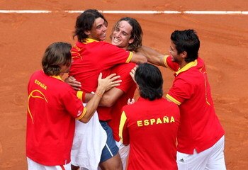 MADRID, SPAIN - SEPTEMBER 21:  Spanish Davis Cup team members (L-R) David Ferrer, Rafael Nadal, Feliciano Lopez,  Fernando Verdasco (Bottem C), Davis Cup coach Emilio Sanchez Vicario and David Ferrer celebrate at the end of the third and final day of the 