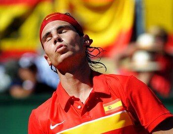 BENIDORM, SPAIN - MARCH 08:  Rafael Nadal of Spain reacts during his match against Novak Djokovic of Serbia on day two of the Davis Cup World Group first round tie between Spain and Serbia at the Parque Tematico Terra Mitica on March 8, 2009 in Benidorm, 