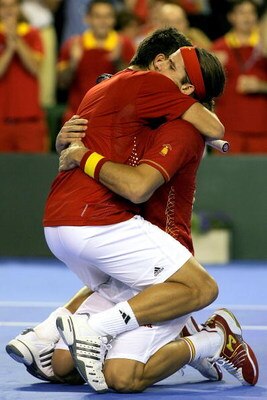 MAR DEL PLATA, ARGENTINA - NOVEMBER 22:  Fernando Verdasco and Feliciano Lopez (R) of Spain celebrate match point against Agustin Calleri and David Nalbandian of Argentina during the third rubber of the Davis Cup final at Estadia Islas Malinas November 22