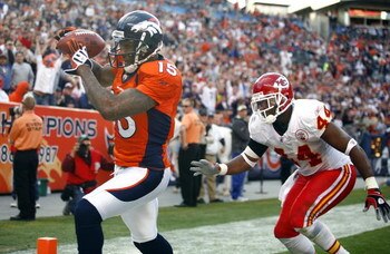 DENVER - DECEMBER 7:  Wide receiver Brandon Marshall #15 of the Denver Broncos catches a touchdown pass in front of Jarrad Page #44 of the Kansas City Chiefs during the second quarter of week 14 NFL action at Invesco Field at Mile High on December 7, 2008