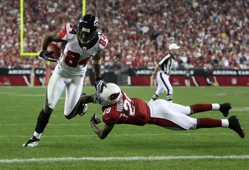 GLENDALE, AZ - JANUARY 03:  Wide receiver Roddy White #84 of the Atlanta Falcons scores a 5 yard touchdown reception past Dominique Rodgers-Cromartie #29 of the Arizona Cardinals during the NFC Wild Card Game on January 3, 2009 at University of Phoenix St