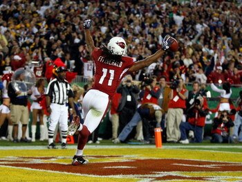 TAMPA, FL - FEBRUARY 01:  Larry Fitzgerald #11 of the Arizona Cardinals celebrates after scoring a touchdown in the fourth quarter against the Pittsburgh Steelers during Super Bowl XLIII on February 1, 2009 at Raymond James Stadium in Tampa, Florida.  (Ph