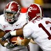 ATLANTA - SEPTEMBER 05:  Running back Mark Ingram #22 of the Alabama Crimson Tide takes a handoff from quarterback Greg McElroy #12 against the Virginia Tech Hokies during the Chick-fil-A Kickoff Game at Georgia Dome on September 5, 2009 in Atlanta, Georg